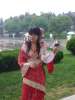 Touriste chinoise vetue de parures traditionnelles pour des photos souvenirs